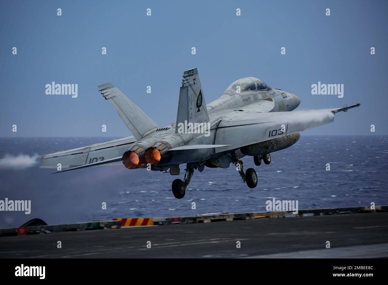 PHILIPPINE SEA (June 15, 2022) An F/A-18F Super Hornet, assigned to the 'Black Aces' of Strike Fighter Squadron (VFA) 41, launches from the flight deck of the Nimitz-class aircraft carrier USS Abraham Lincoln (CVN 72). Abraham Lincoln Strike Group is on a scheduled deployment in the U.S. 7th Fleet area of operations to enhance interoperability through alliances and partnerships while serving as a ready-response force in support of a free and open Indo-Pacific region. Stock Photo