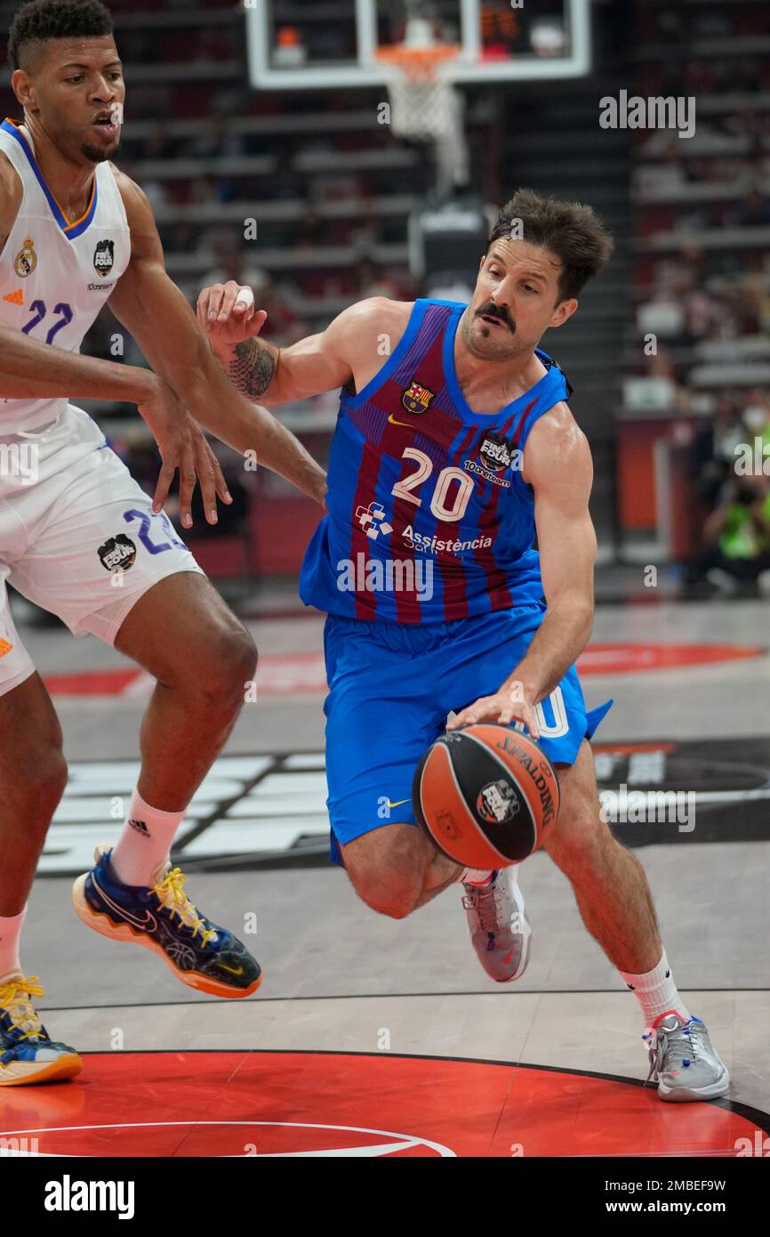 Barcelona's Nicolas Laprovittola drives to the basket flanked by Real  Madrid's Walter Tavares during their Final Four Euroleague semifinal  basketball match between Barcelona and Real Madrid, in Belgrade, Serbia,  Thursday, May 19,