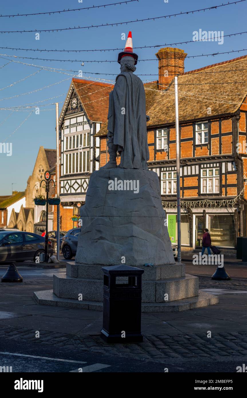 Traffic cone on the statue of Alfred the Great, Wantage, UK Stock Photo