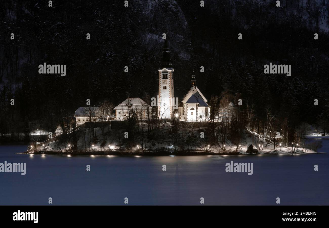 Bled, Slovenia - January 20th 2023: The Sanctuary of the Assumption of the Virgin Mary in Slovenia in a winter night. Stock Photo