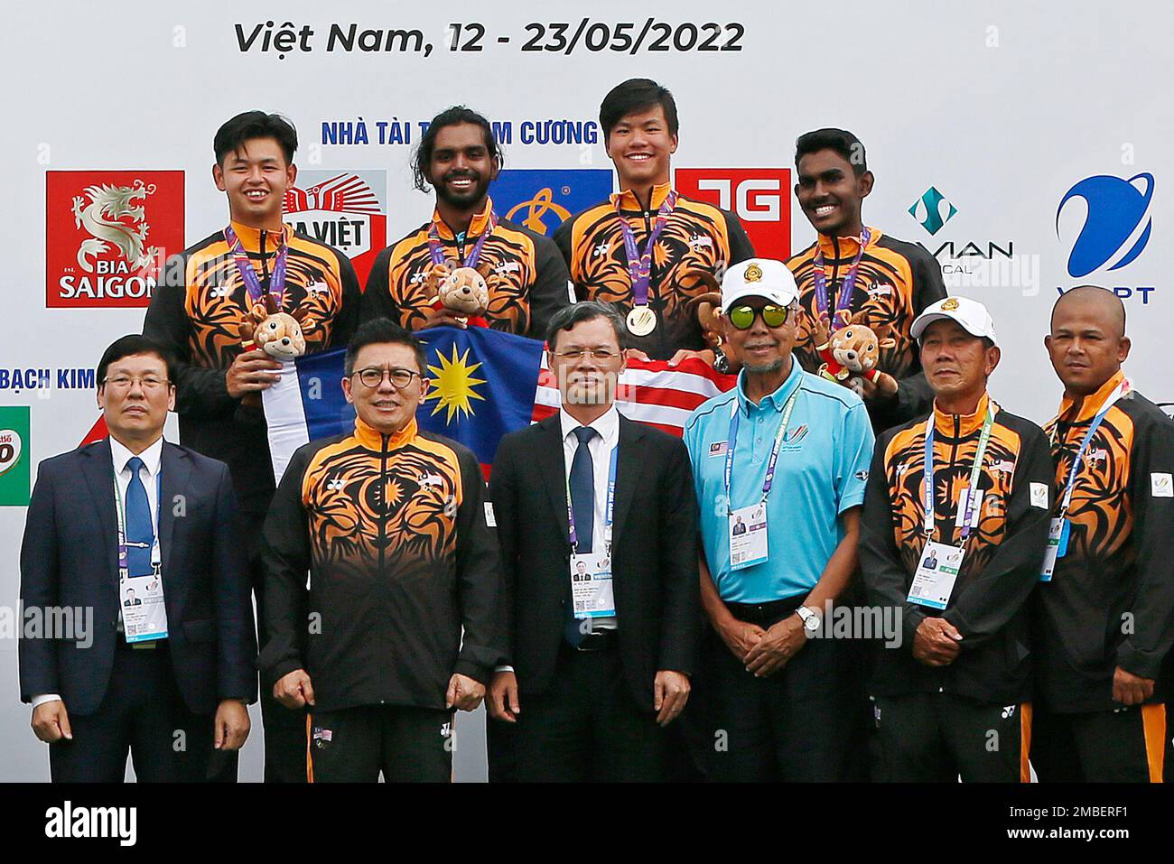 Team Malaysia poses on the podium with their gold medals during the ...