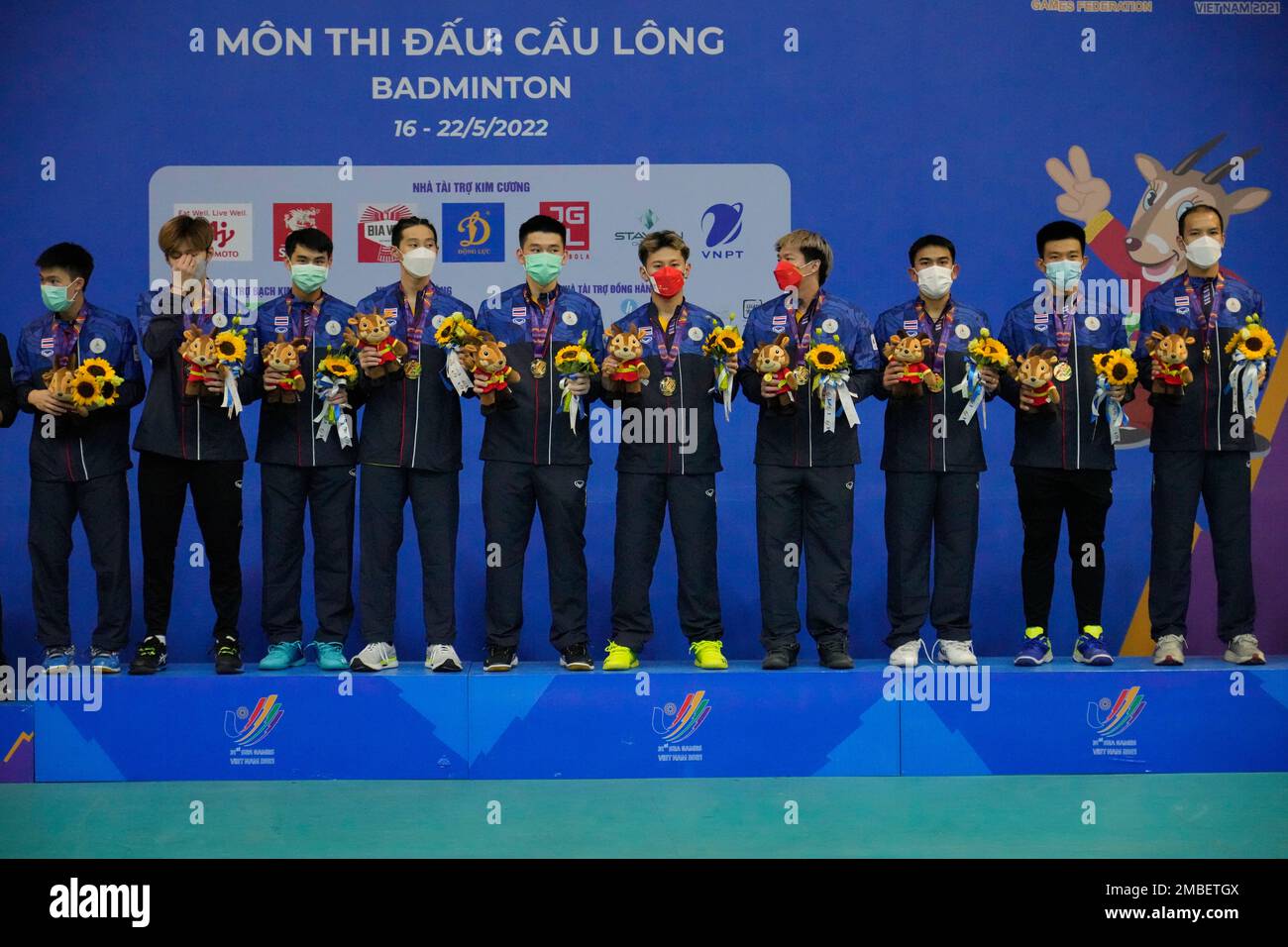 Team Thailand celebrates on the podium with their gold medals after defeating Malaysia in their mens team badminton final match at the 31st Southeast Asian Games (SEA Games), Wednesday, May 18, 2022