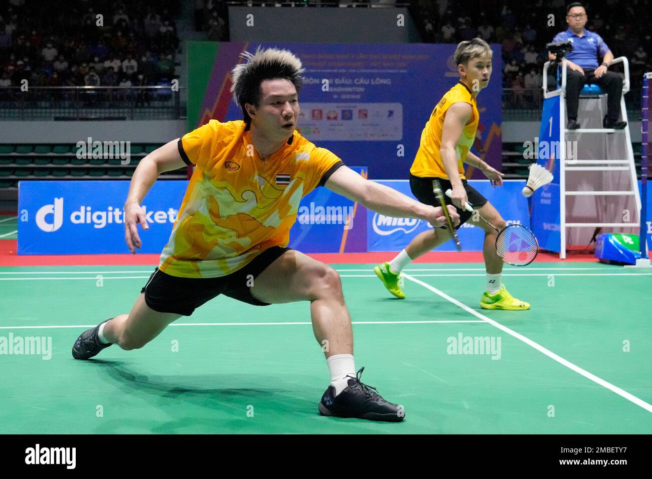 Thailands Chaloempon Charoenkitamorn, right, and Nanthakam Yordphaisong play against Malaysias Man Wei Chong and Tee Kai Wun during their mens team badminton final match at the 31st Southeast Asian Games (SEA Games),