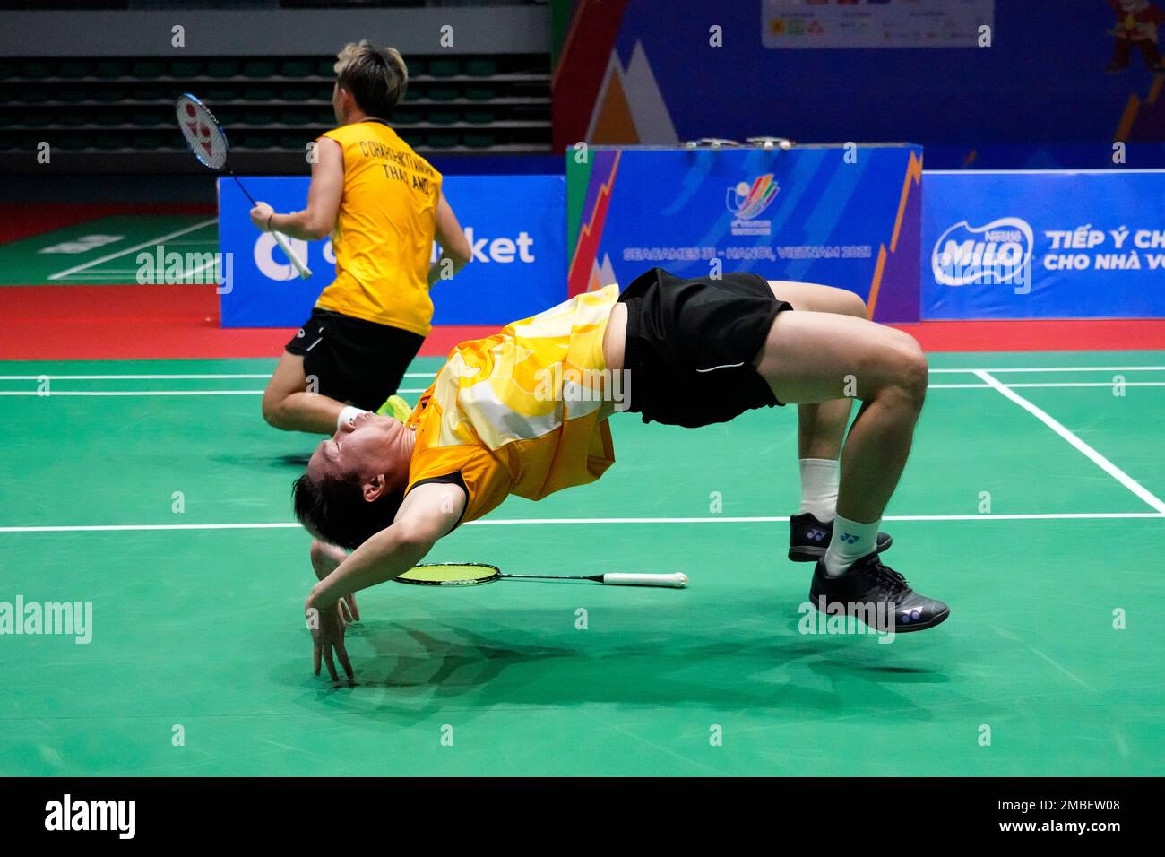 Thailands Chaloempon Charoenkitamorn, rear, and Nanthakam Yordphaisong, bottom, celebrate after defeating Malaysias Man Wei Chong and Tee Kai Wun during their mens team badminton final match at the 31st Southeast Asian Games (