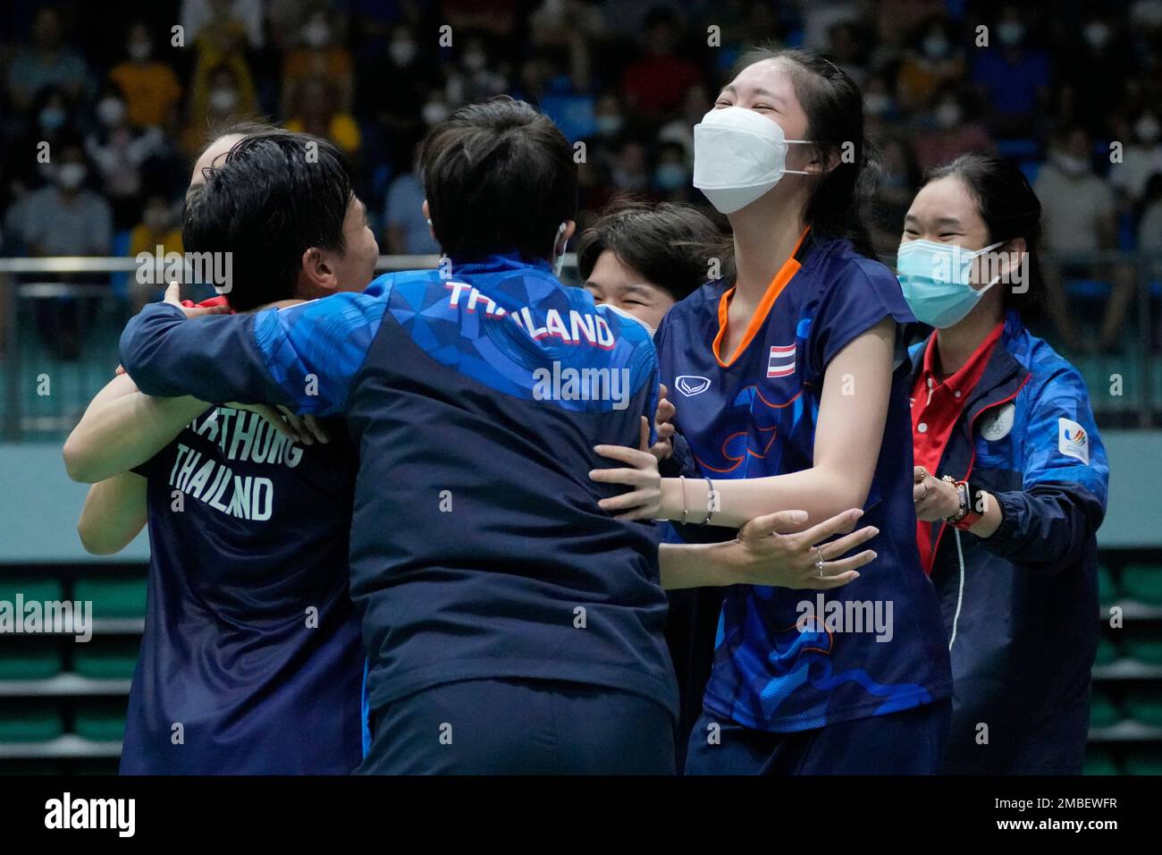 Team Thailand celebrates after defeating Indonesia in their women's