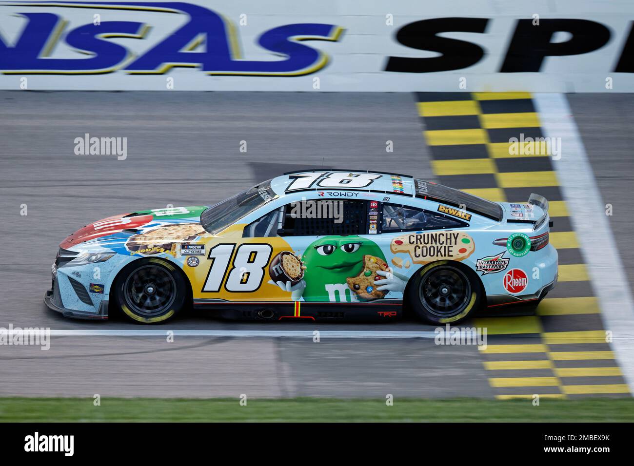 Kyle Busch (18) crosses over the start/finish line as he heads toward Turn  1 during a NASCAR Cup Series auto race at Kansas Speedway in Kansas City,  Kan., Sunday, May 15, 2022. (