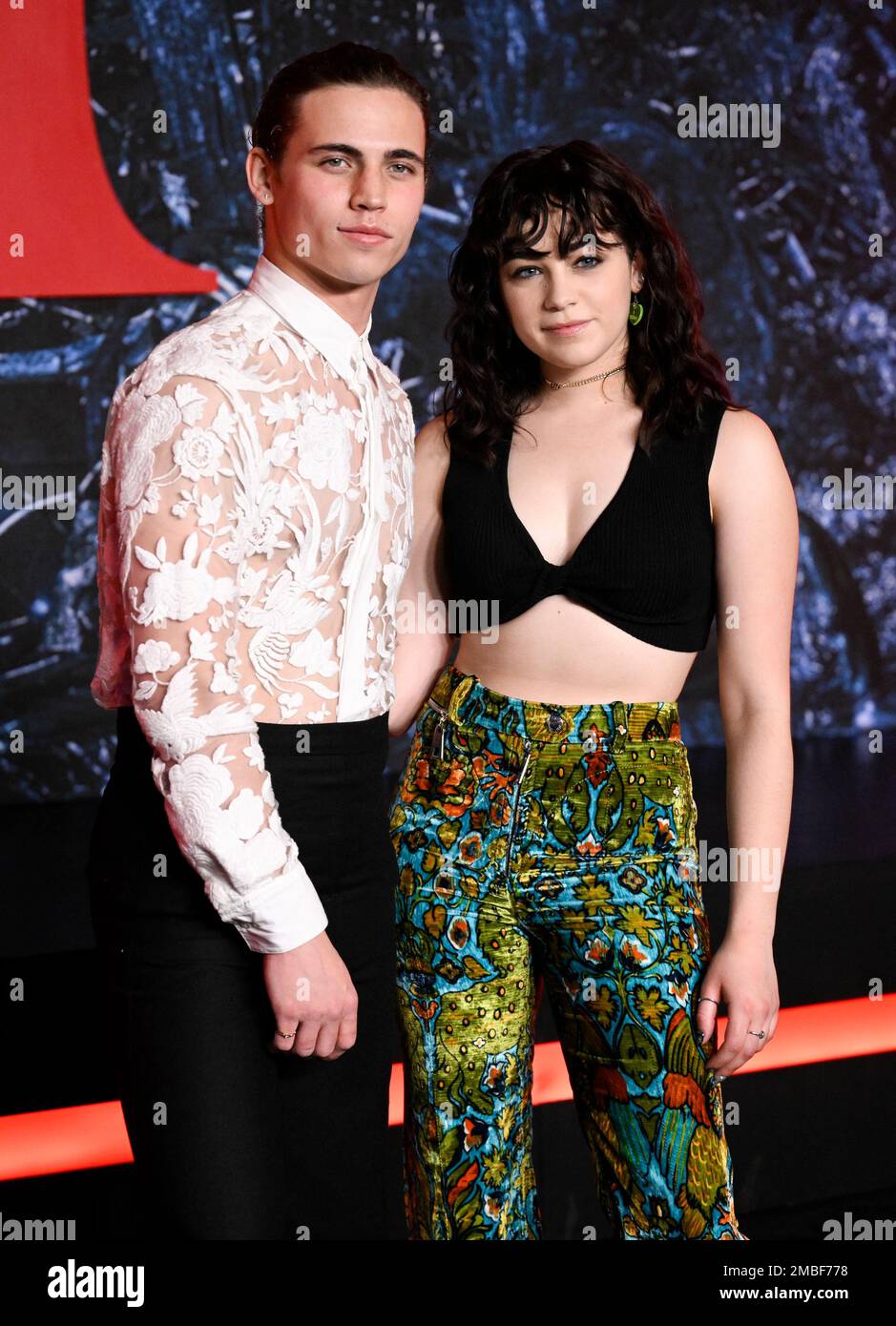 Tanner Buchanan, left, and Mary Mouser attend the premiere of "Stranger