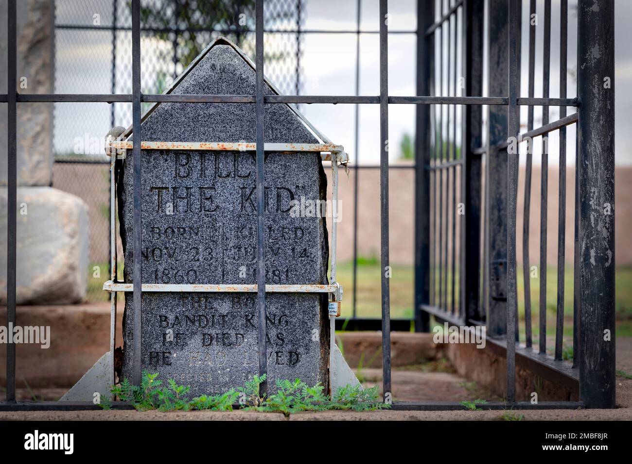 The tombstone of Henry McCarty, aka William H. Bonney, and Billy the Kid at the Old Fort Sumner Cemetery in Fort Sumner, New Mexico. Stock Photo
