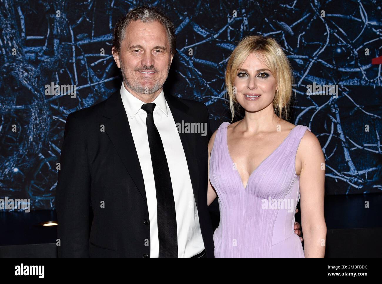 Cara Buono, right, and husband Peter Thum attend the premiere of