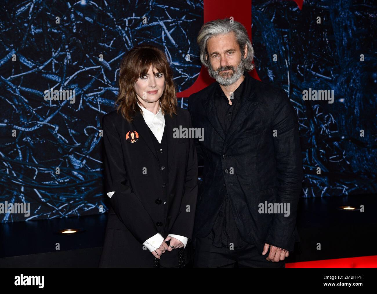 Winona Ryder, left, and husband Scott Mackinlay Hahn attend the