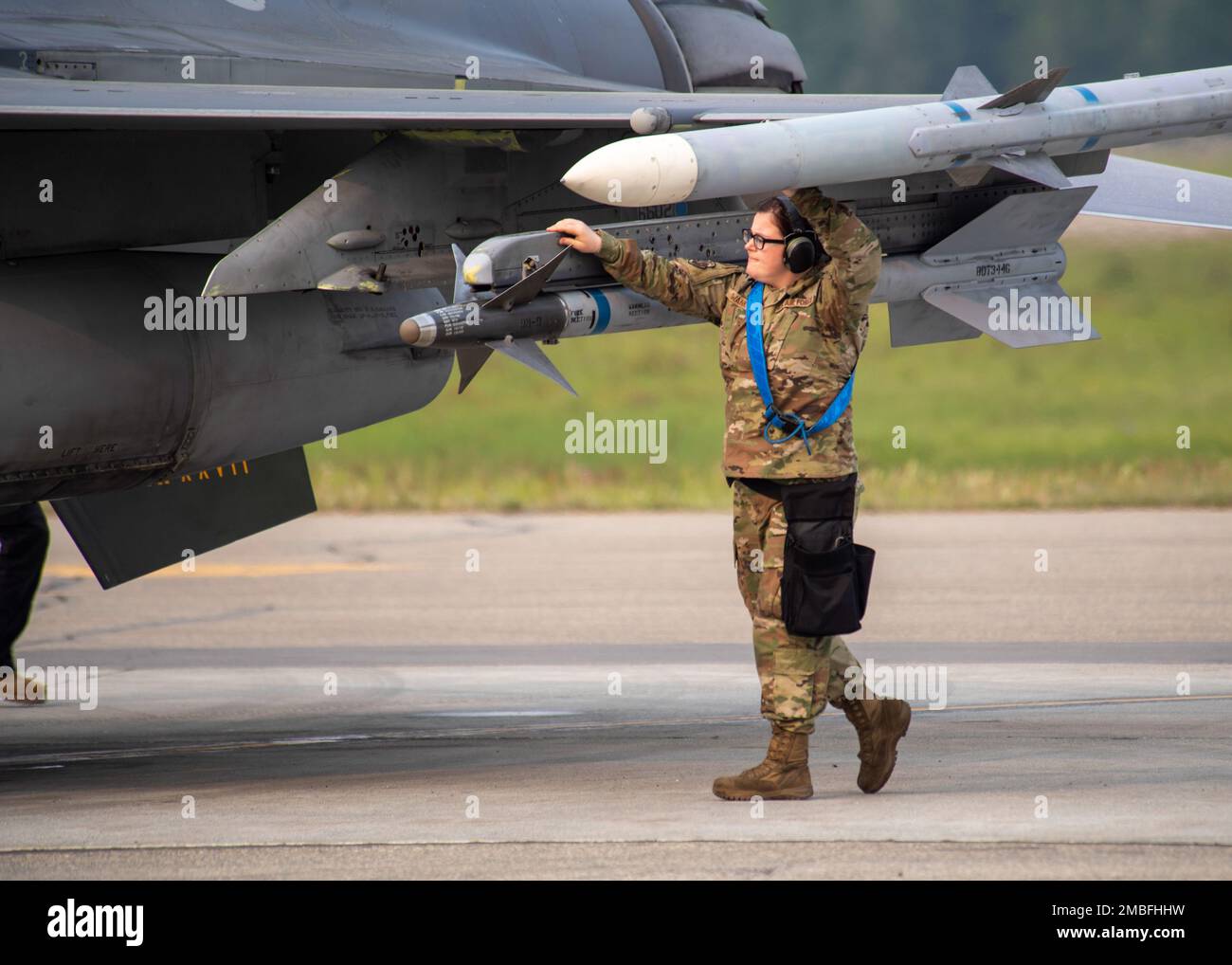 U.S. Air Force Senior Airman Katarina Swank, 35th Aircraft Maintenance Unit  aircraft armament specialist, does a final check of the weapons loaded onto  a F-16 Fighting Falcon belonging to the 35th Fighter
