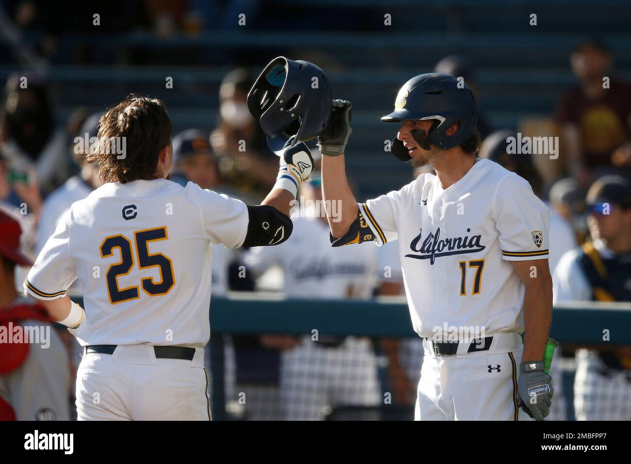 Nathan Martorella of Cal celebrates with Dylan Beavers after hitting a