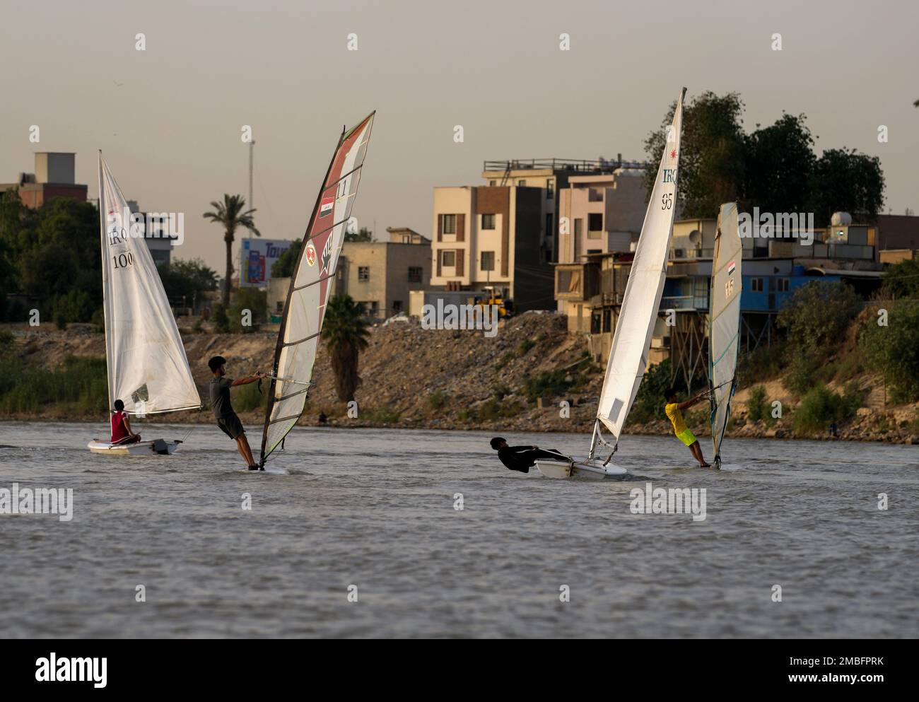 Members of the Iraqi national windsurfing team train in the Tigris