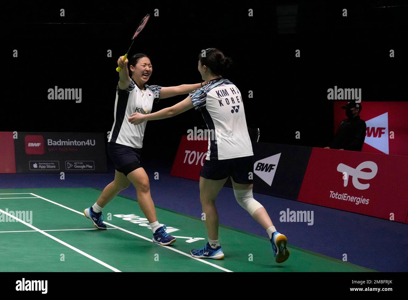 South Koreas Kong Hee-yong, left, and Kim Hye-jeong react after winning over Chinas Huang Dong Ping and Li Wen Mei during their womens double final badminton match at Thomas and Uber Cup