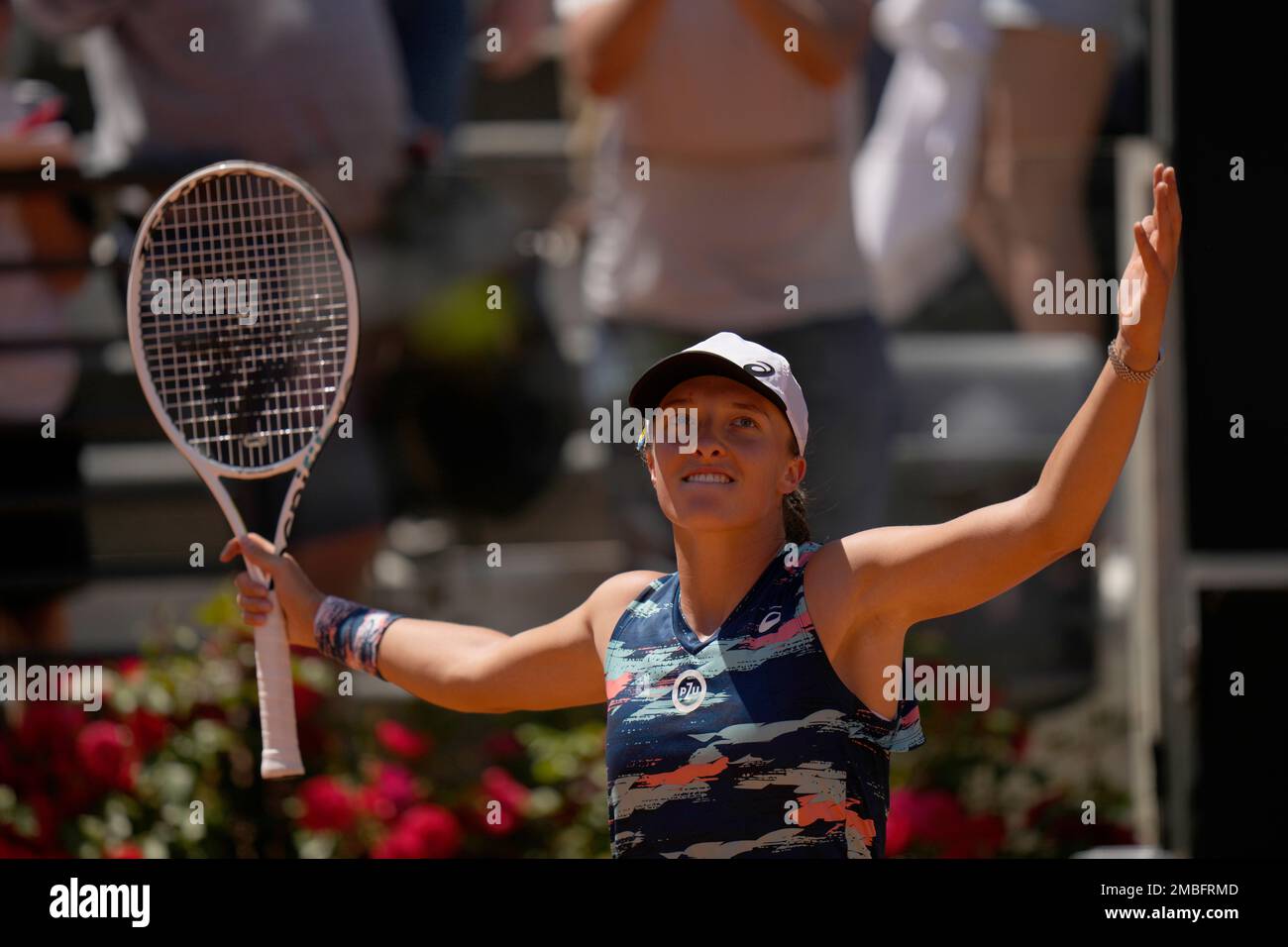 Iga Swiatek of Poland celebrates after winning her semifinal match against Aryna Sabalenka from Belarus at the Italian Open tennis tournament, in Rome, Saturday, May 14, 2022