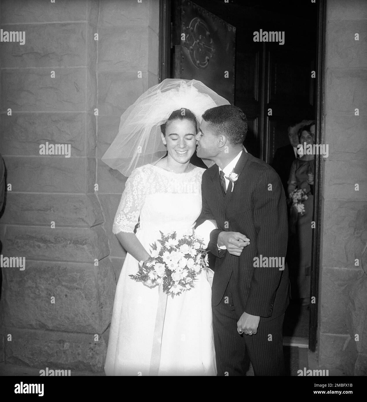 Margaret Elizabeth Rusk, 18, daughter of Secretary of State Dean Rusk, gets  a kiss from Guy Gibson Smith, 22, as they leave Stanford Memorial Chapel in  Stanford, Calif., after their marriage Sept.