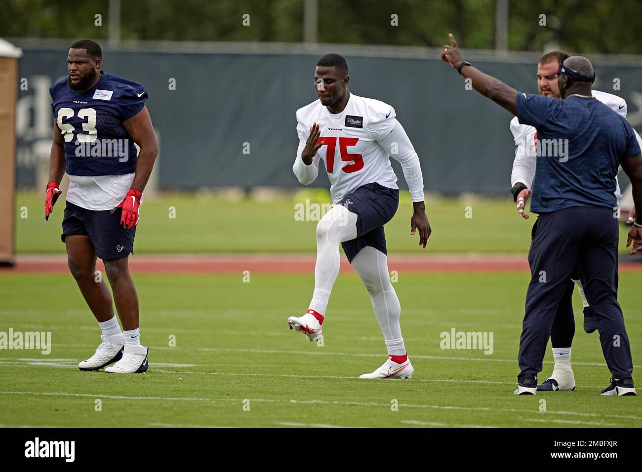 Houston Texans' Adedayo Odeleye (75) stretches during an NFL