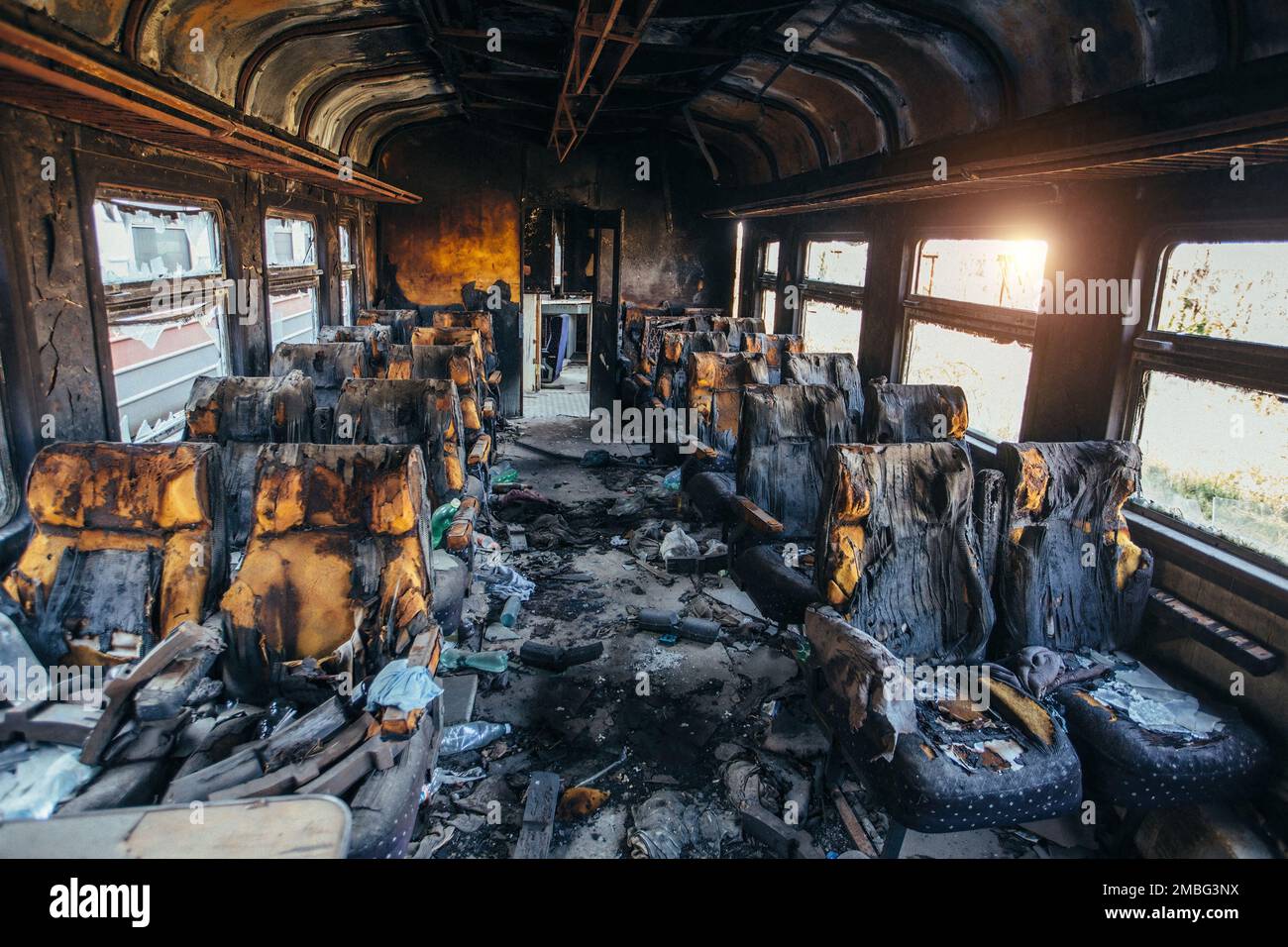 Train after fire. Burnt interior of passenger carriage. Consequences of