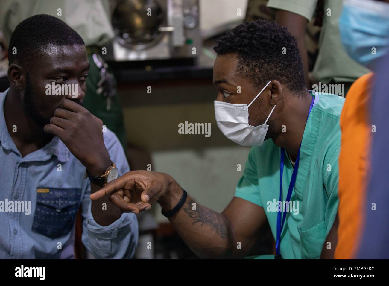 U.S. Army Sgt. Teddy BienAime (right), biomedical equipment specialist