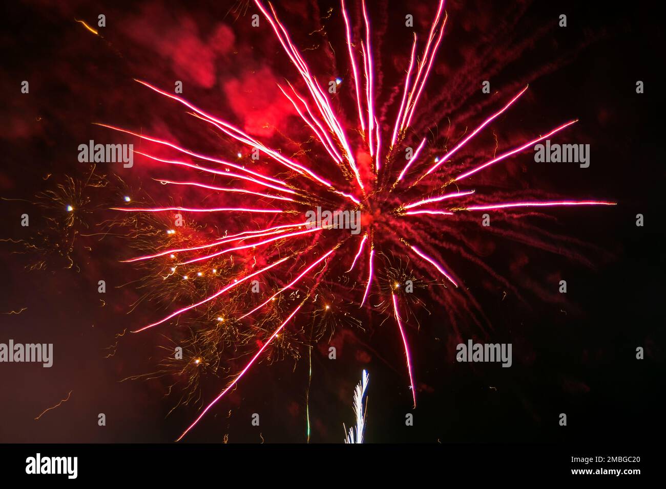 Fireworks in the night sky. Thousands of exploding colors and lights tear the sky. Stock Photo