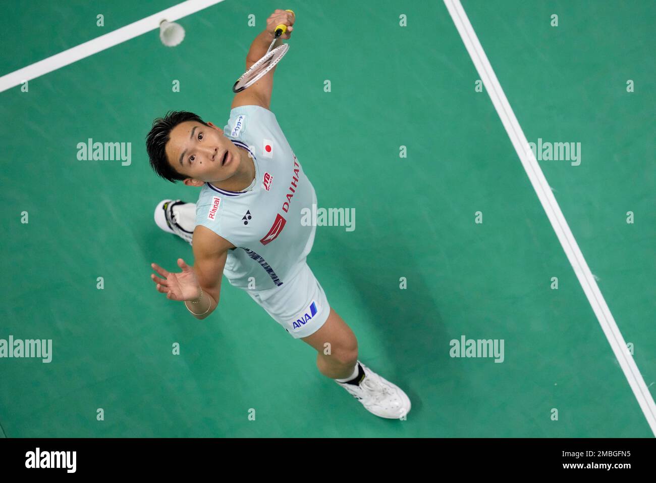 Japans Kento Momota returns a shot to Englands Toby Penty during their mens singles qualifying match at Thomas and Uber Cup in Bangkok, Thailand, Tuesday, May 10, 2022