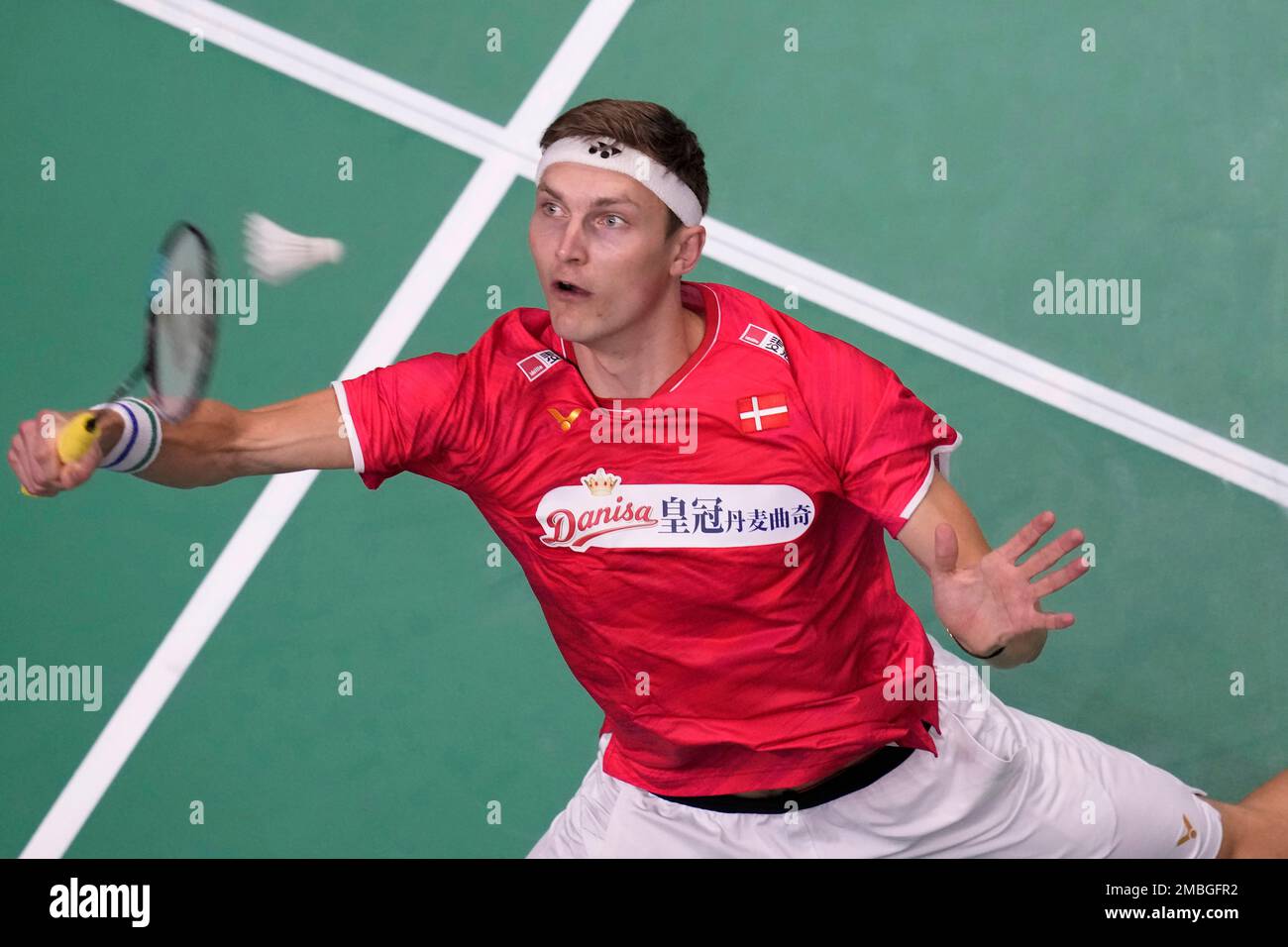 Denmarks Viktor Axelsen returns a shot to Frances Toma Junior Popov during their mens singles qualifying match at Thomas and Uber Cup in Bangkok, Thailand, Tuesday, May 10, 2022