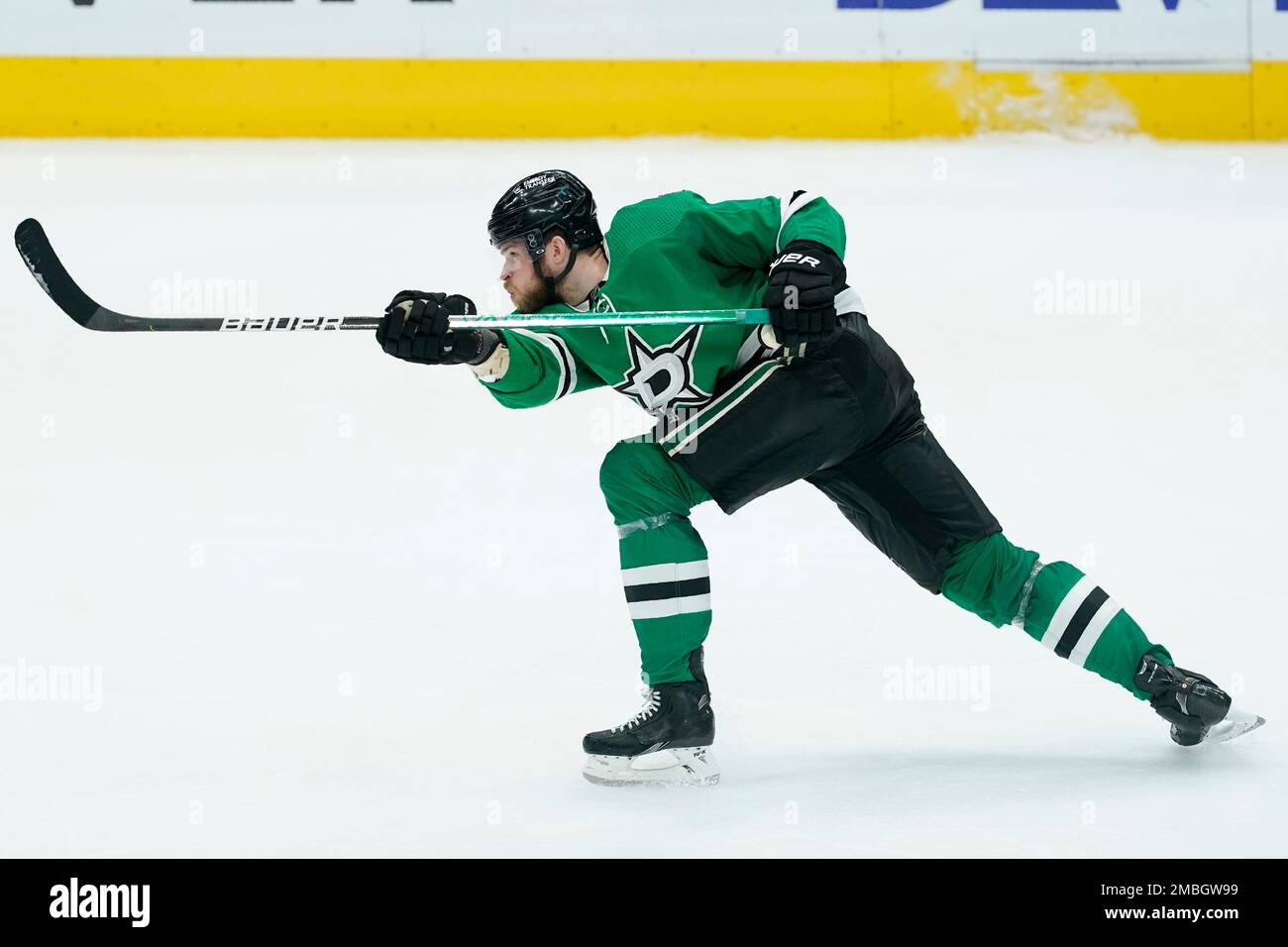 Dallas Stars defenseman Jani Hakanpaa takes a shot during Game 3 of an NHL hockey Stanley Cup first-round playoff series against the Calgary Flames, Sunday, May 8, 2022, in Dallas. (AP Photo/Tony Gutierrez) Stock Photo