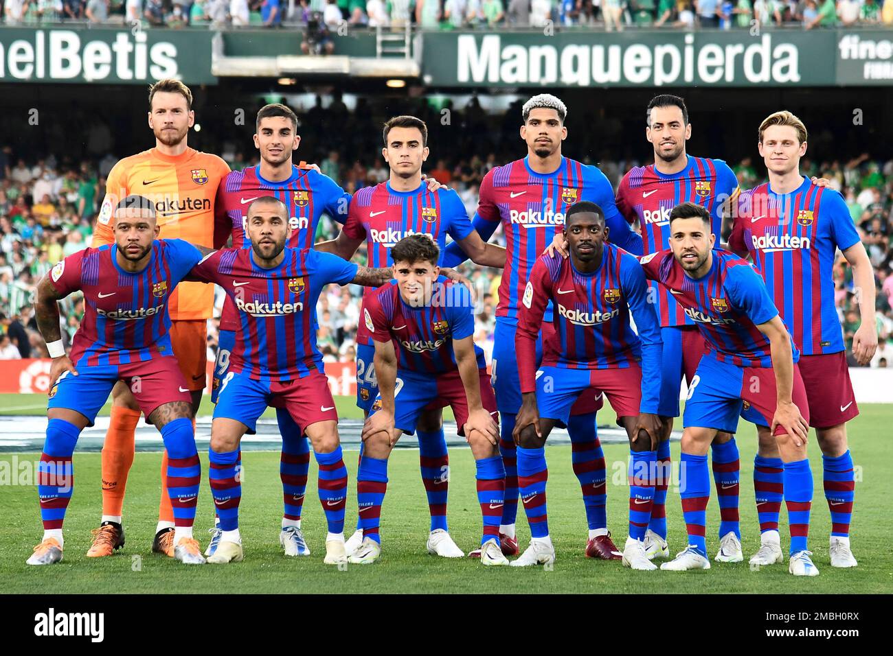 Barcelona starting players pose for a team photo at the beginning of the Spanish La Liga soccer