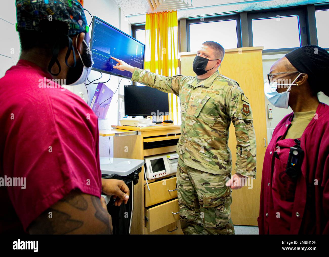 U.S. Air Force Master Sgt. Caige Chapman, noncommissioned officer in charge, Labor, Delivery, Recovery, Postpartum Unit, Landstuhl Regional Medical Center, discusses patient information to LDRP staff, June 15. Chapman, a native of Castroville, Texas, was recently recognized for his performance following a last-minute deployment in support of the 435th Contingency Response Group to Poland. Stock Photo