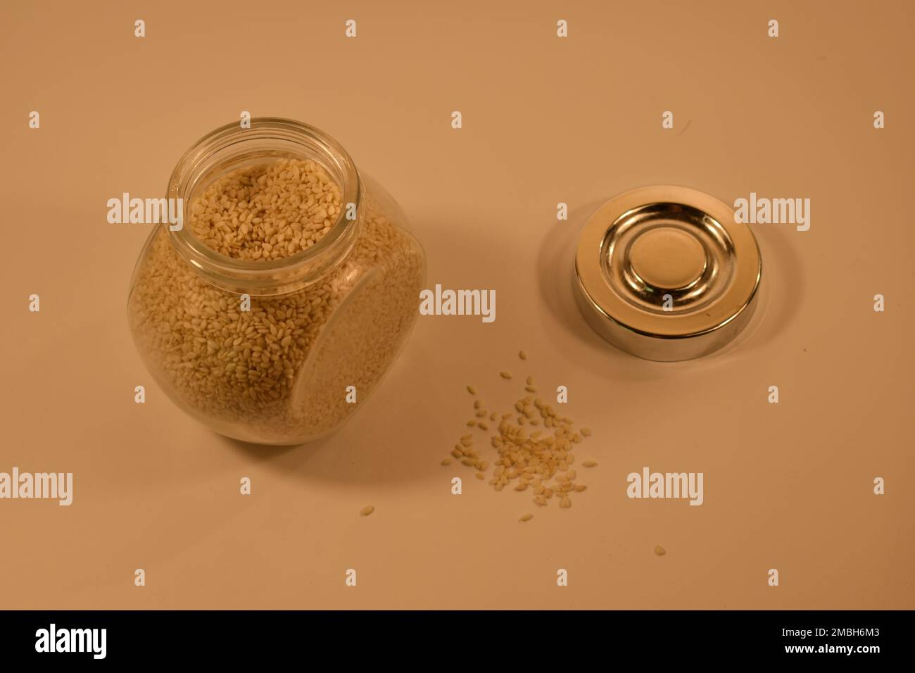 Jar of sesame seeds shoot on a white background Stock Photo Alamy