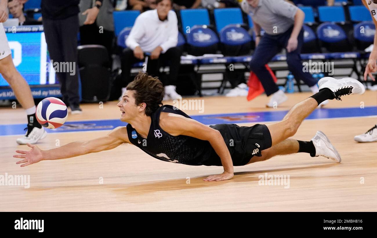 Long Beach State libero Mason Briggs digs a serve during a semifinal