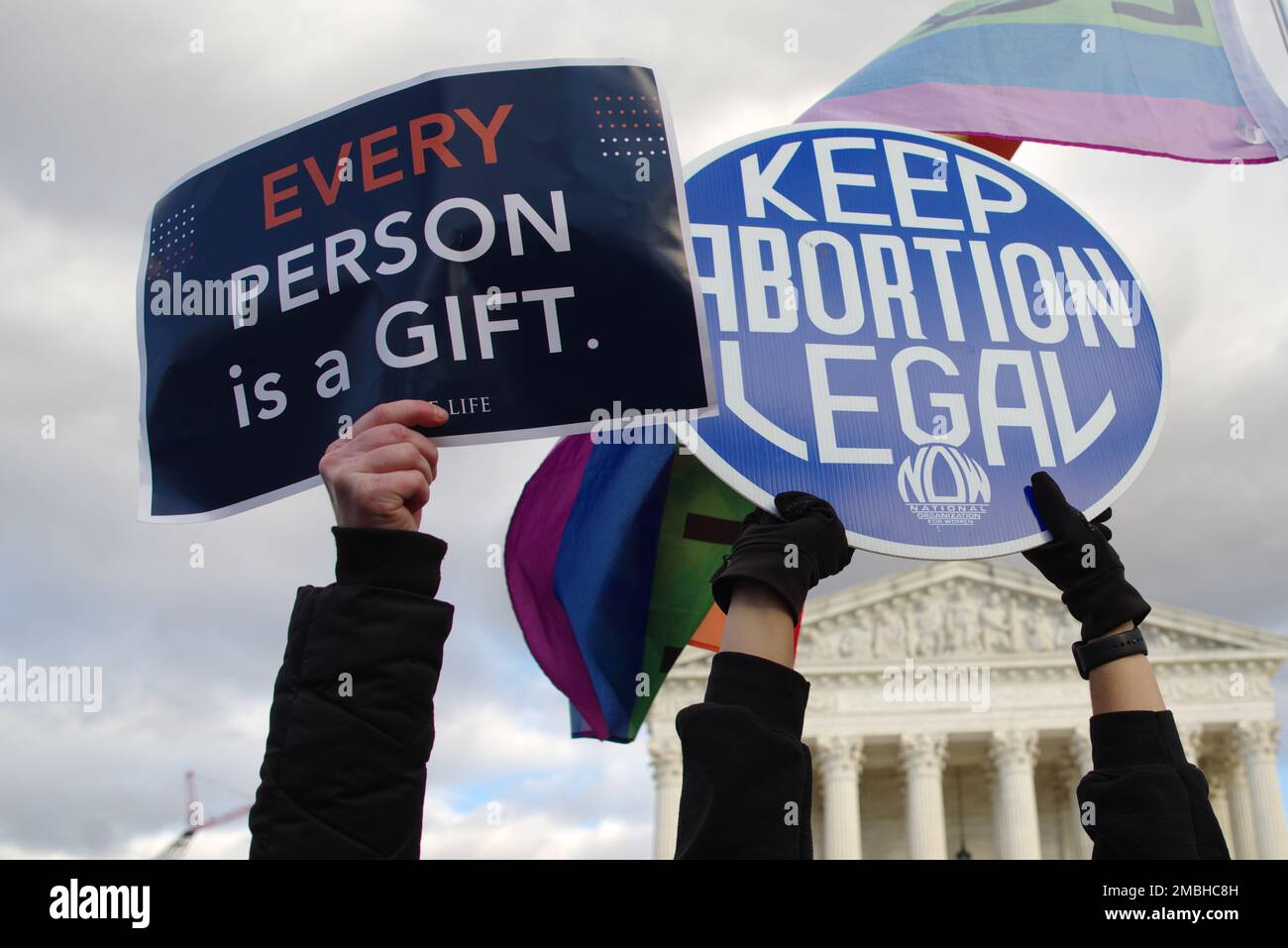 Washington DC, USA. 20 Jan 2023. Protesters hold up competing signs at the March for Life at the United States Supreme Court. Credit: Philip Yabut/Alamy Live News Stock Photo