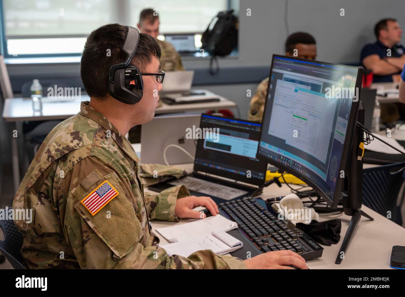 A cyber operations soldier searches for network intrusion as a "Blue