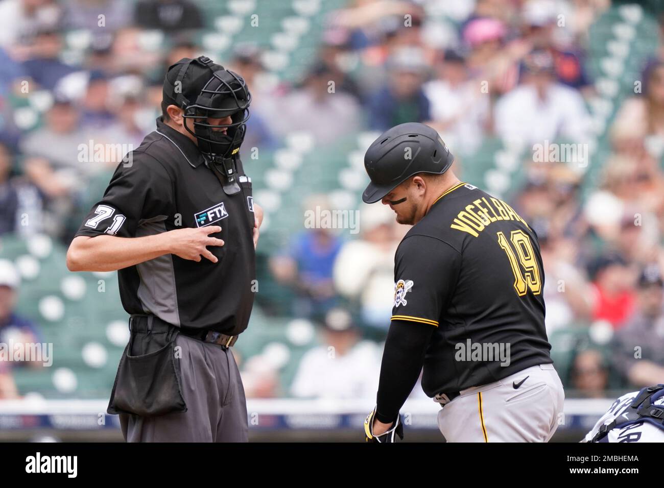 Pittsburgh Pirates' Daniel Vogelbach listens to home plate umpire