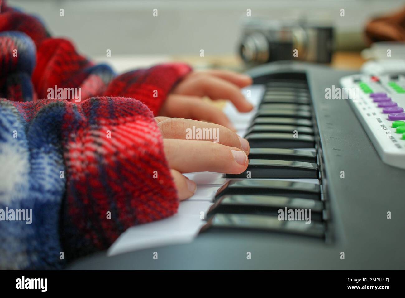 boy playing toy keyboard piano at home Stock Photo Alamy