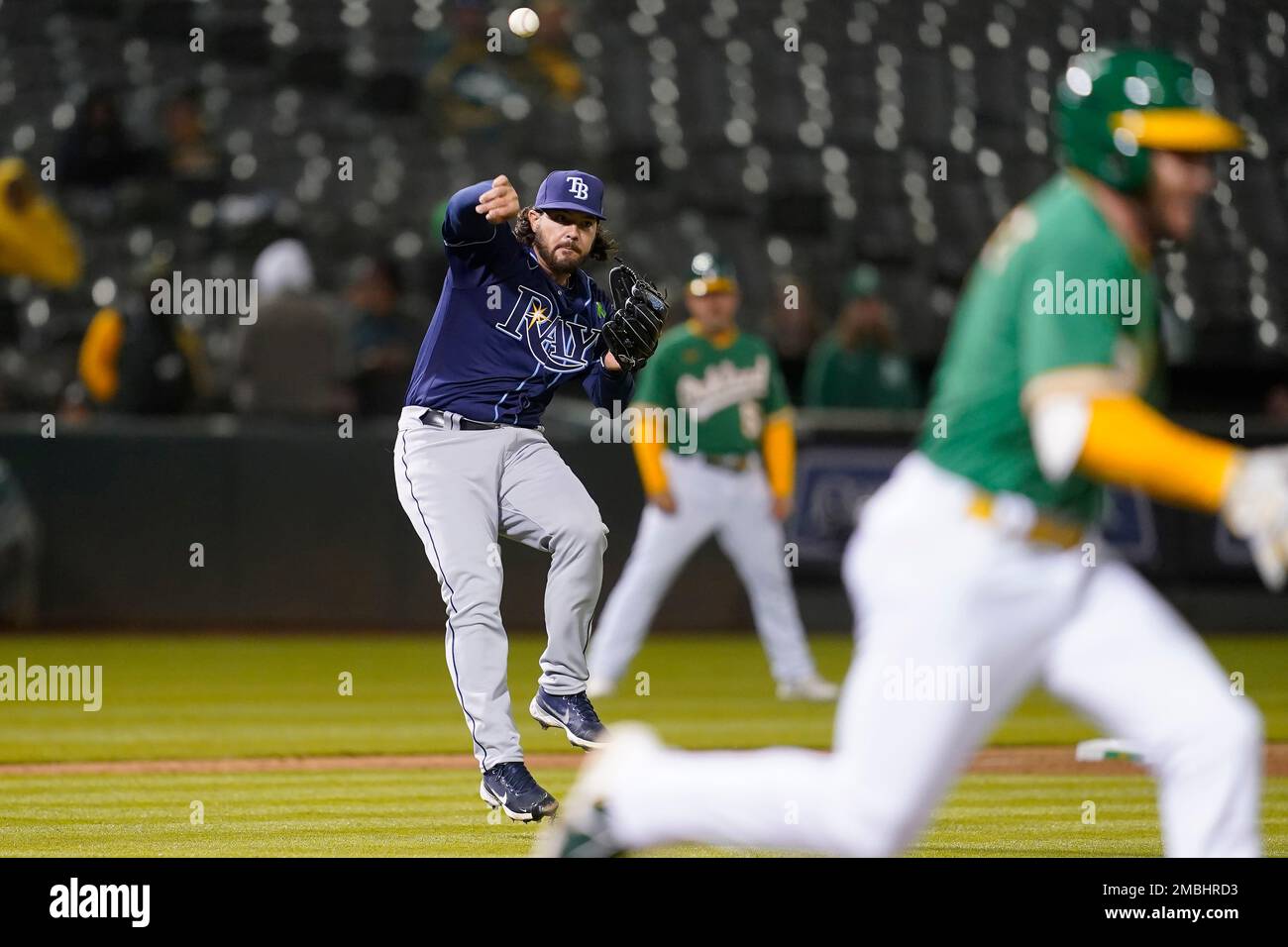 Tampa Bay Rays pitcher Phoenix Sanders, left, throws to first base