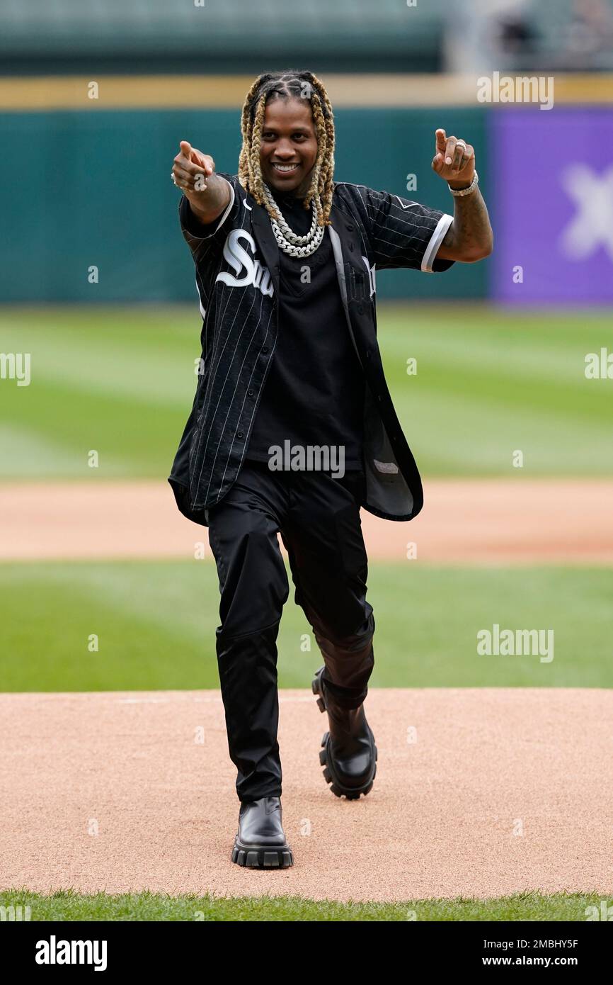 Chicago rapper Lil Durk reacts after throwing out a ceremonial first