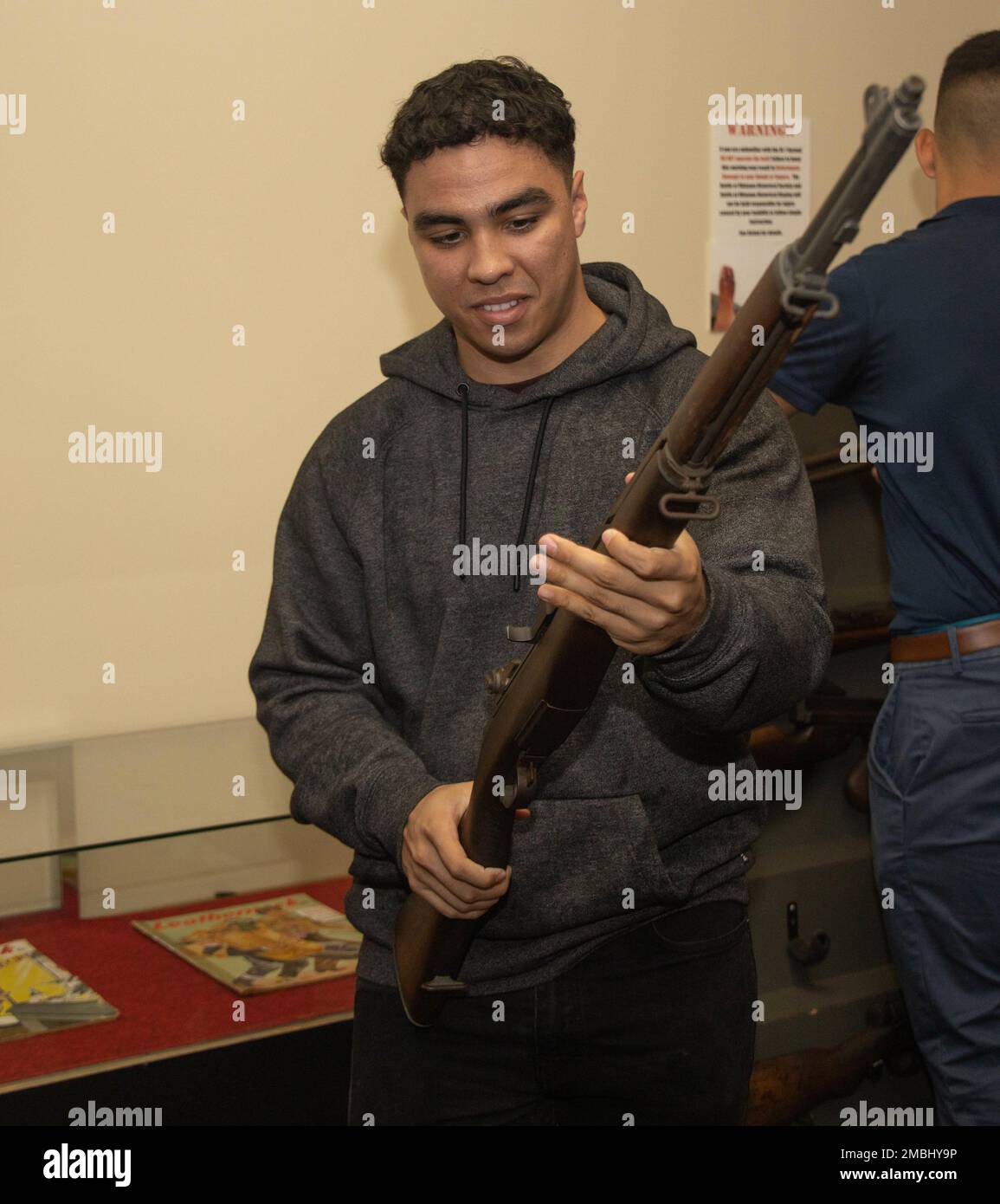 U.S. Marine Corps Sgt. Abel Rivera, a food service specialist with Food Service company, Combat Logistics Regiment 37, 3rd Marine Logistics Group, holds an M1 Garand rifle recovered after the battle of Okinawa at the Battle of Okinawa Historical Display on Camp Kinser, Okinawa, Japan, June 16, 2022. Marines with Food Service company visited different World War II battle sites of Okinawa during a professional military education event to better understand their history and culture. Stock Photo
