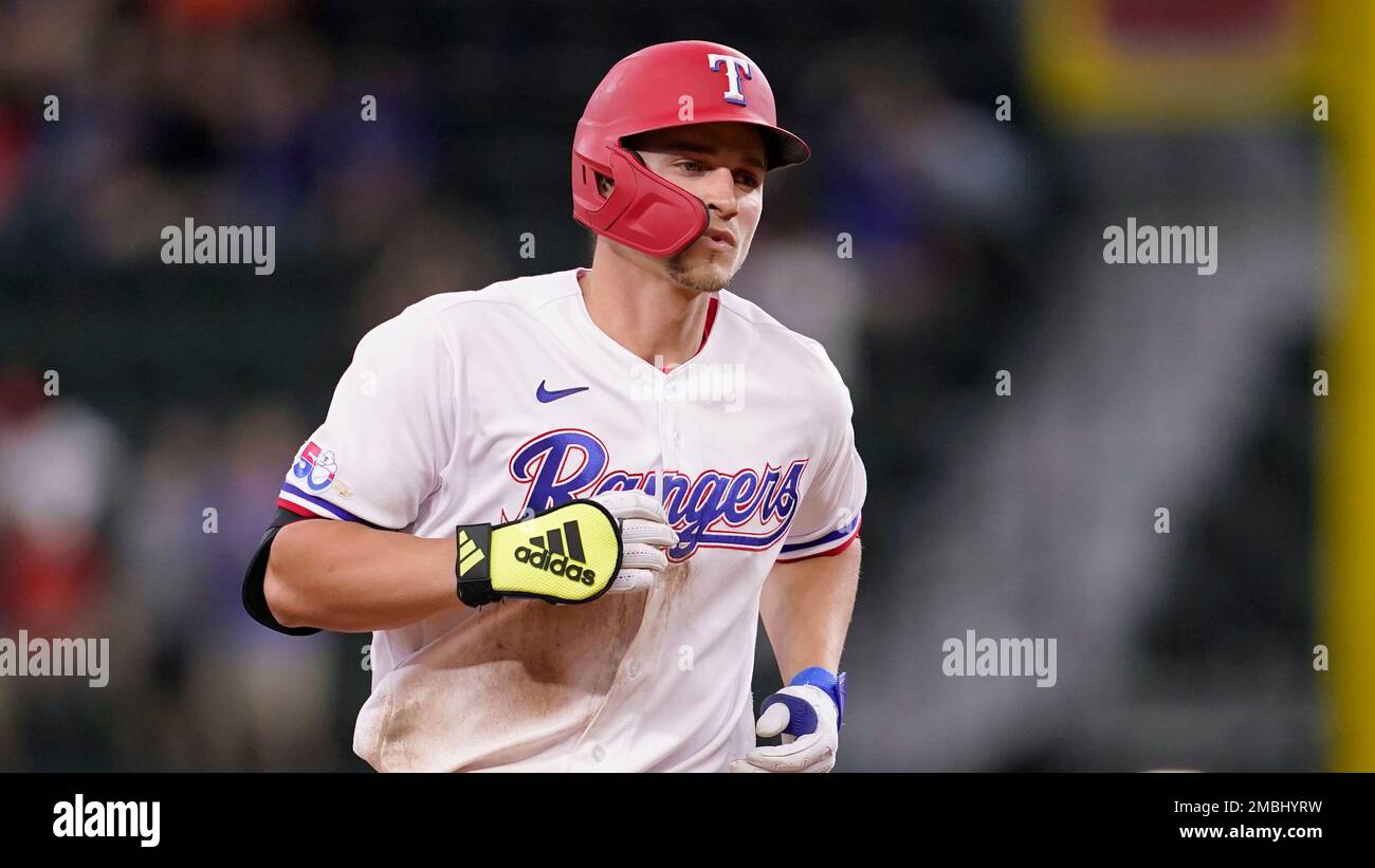 Texas Rangers' Corey Seager rounds the bases after hitting a solo
