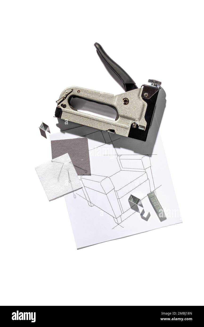 Silver furniture stapler gun with staples and the drawing of the