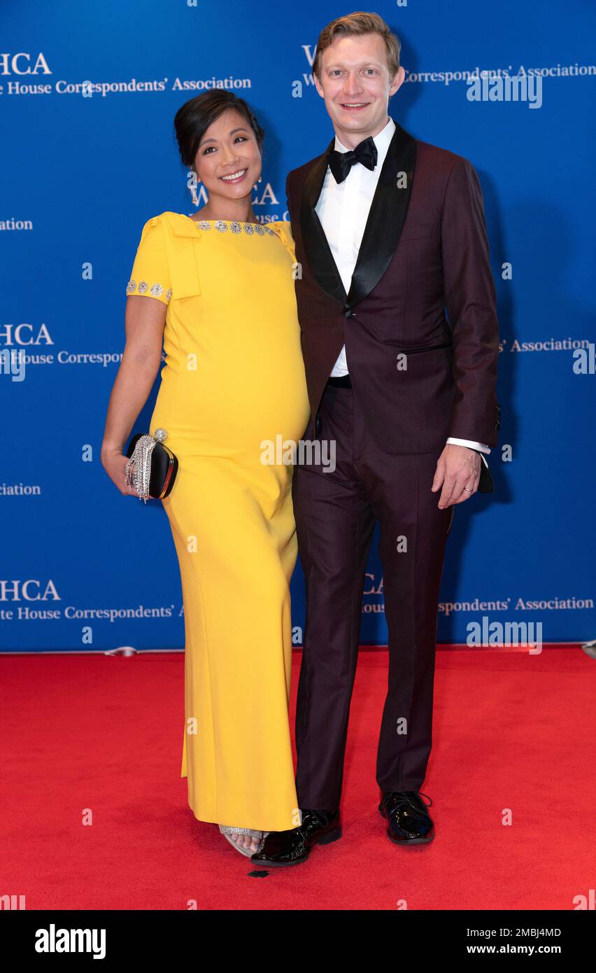 Weijia Jiang and her husband Travis Luther Lowe poses for photographers ...