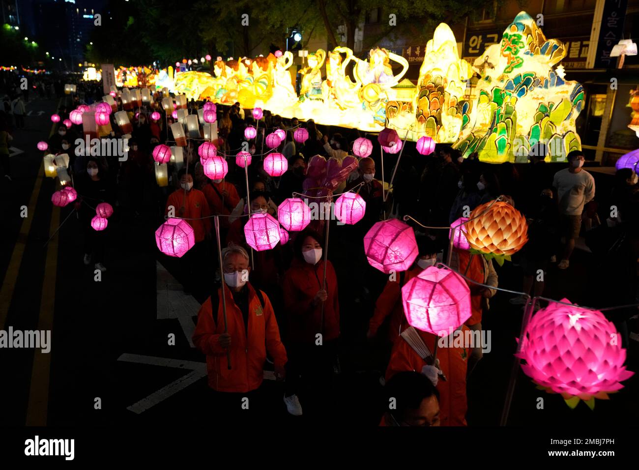 Buddhists carry lanterns in a parade during the Lotus Lantern Festival to celebrate the upcoming birthday of Buddha on May 8 in Seoul, South Korea, Saturday, April 30, 2022. (AP Photo/Lee Jin-man) Stock Photo