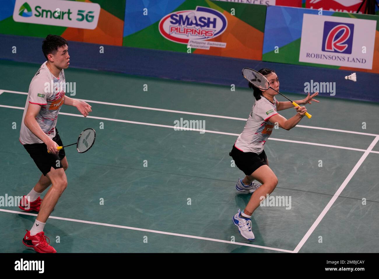 Malaysias Pei Jing Lai, right, and Kian Meng Tan compete against Japans Arisa Higashino and Yuta Watanabe during their mixed doubles quarterfinals match at the Badminton Asia Championships 2022 at Muntinlupa, Philippines