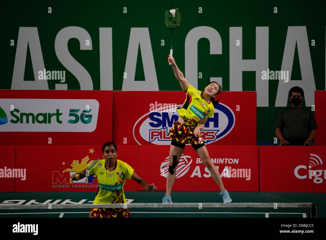 Malaysia's Thinaah Muralitharan and Pearly Tan use three languages to communicate on the badminton court