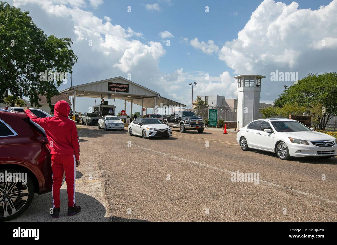 Vehicles exit the front gates at the conclusion of the Angola Prison ...