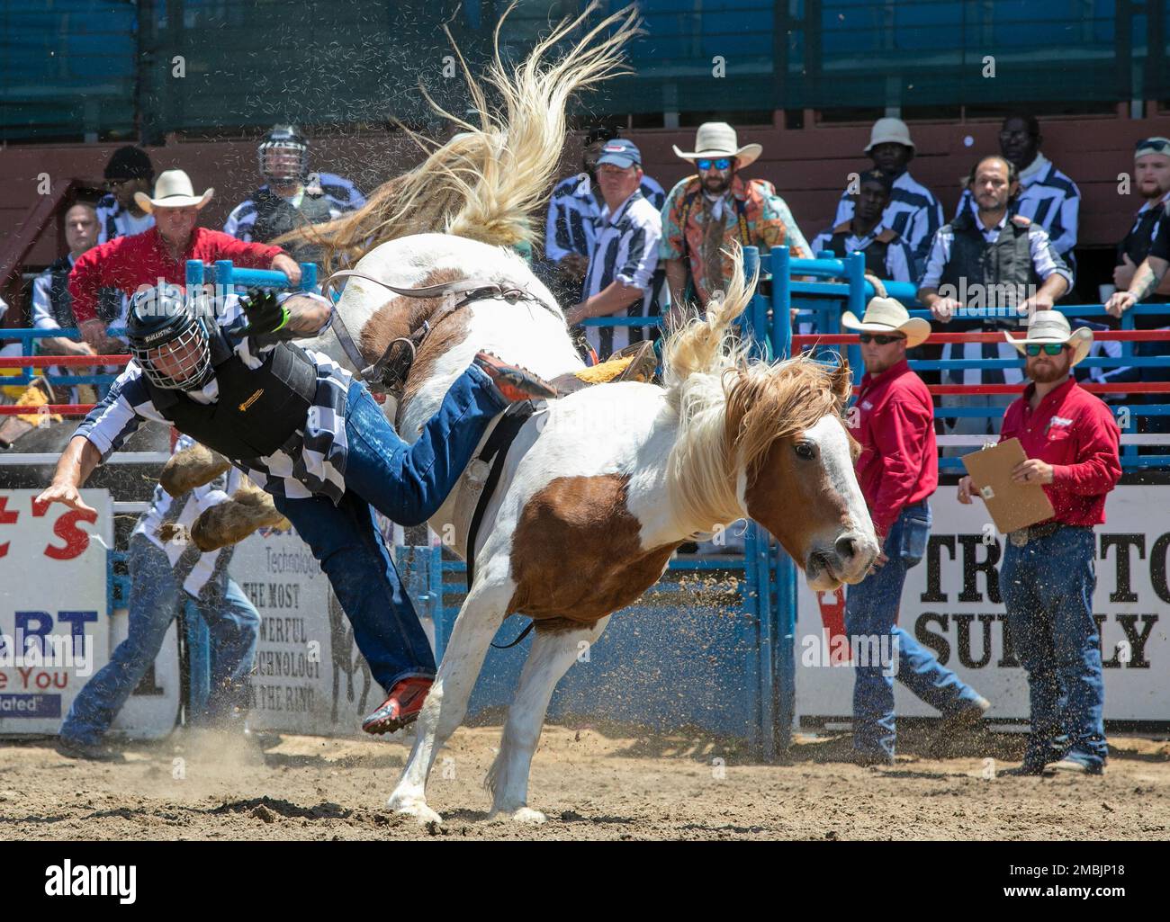 An inmate heads for the dirt during the 