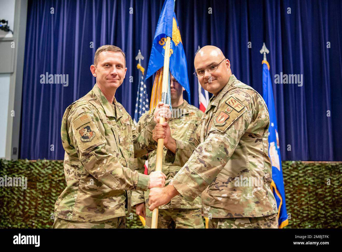 U.S. Air Force Maj. Kendall P. Benton, right, 422d Security Forces Squadron incoming commander, receives the 422d SFS guidon from Col. Jon T. Hannah, 422d Air Base Group commander, during a change of command ceremony at RAF Croughton, England, June 16, 2022. Prior to assuming command of the 422d SFS, Benton served as the Action Officer for the Policy Branch in the Air Force Security Forces Directorate at the Pentagon in Washington, D.C. Stock Photo