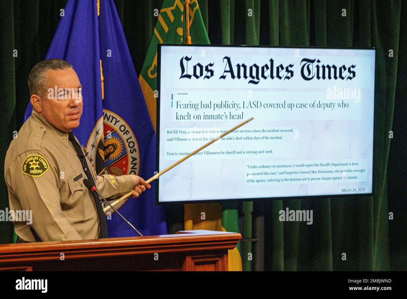 Los Angeles County Sheriff Alex Villanueva points to a Los Angeles