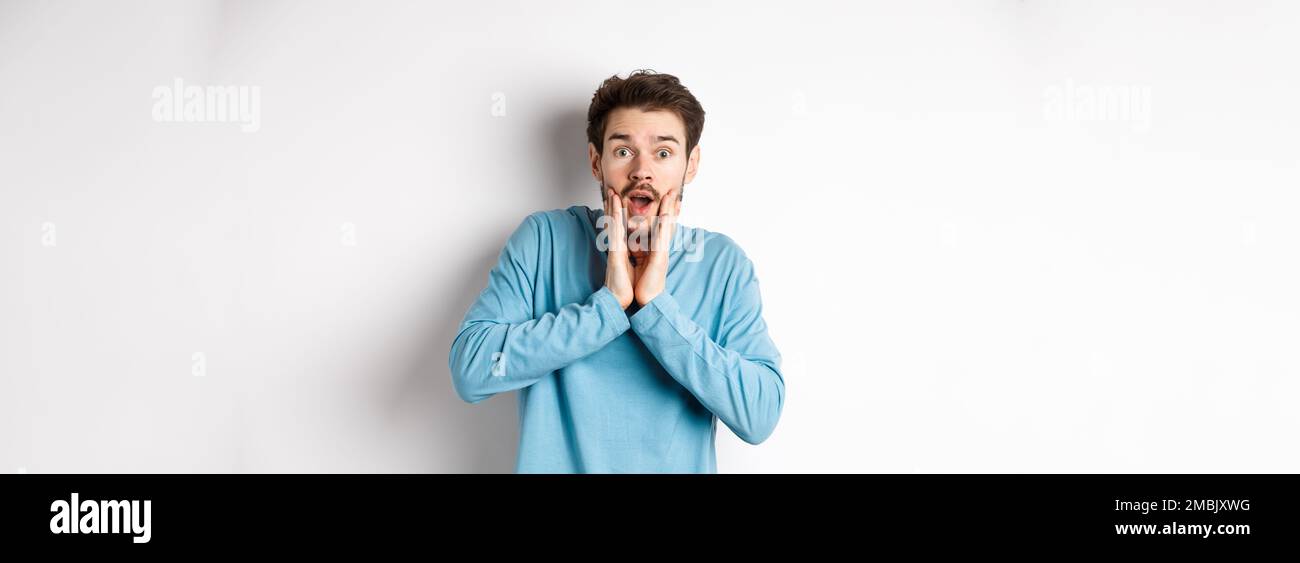 Indignant Gasp Image of handsome man gasping and staring at camera surprised, checking ...