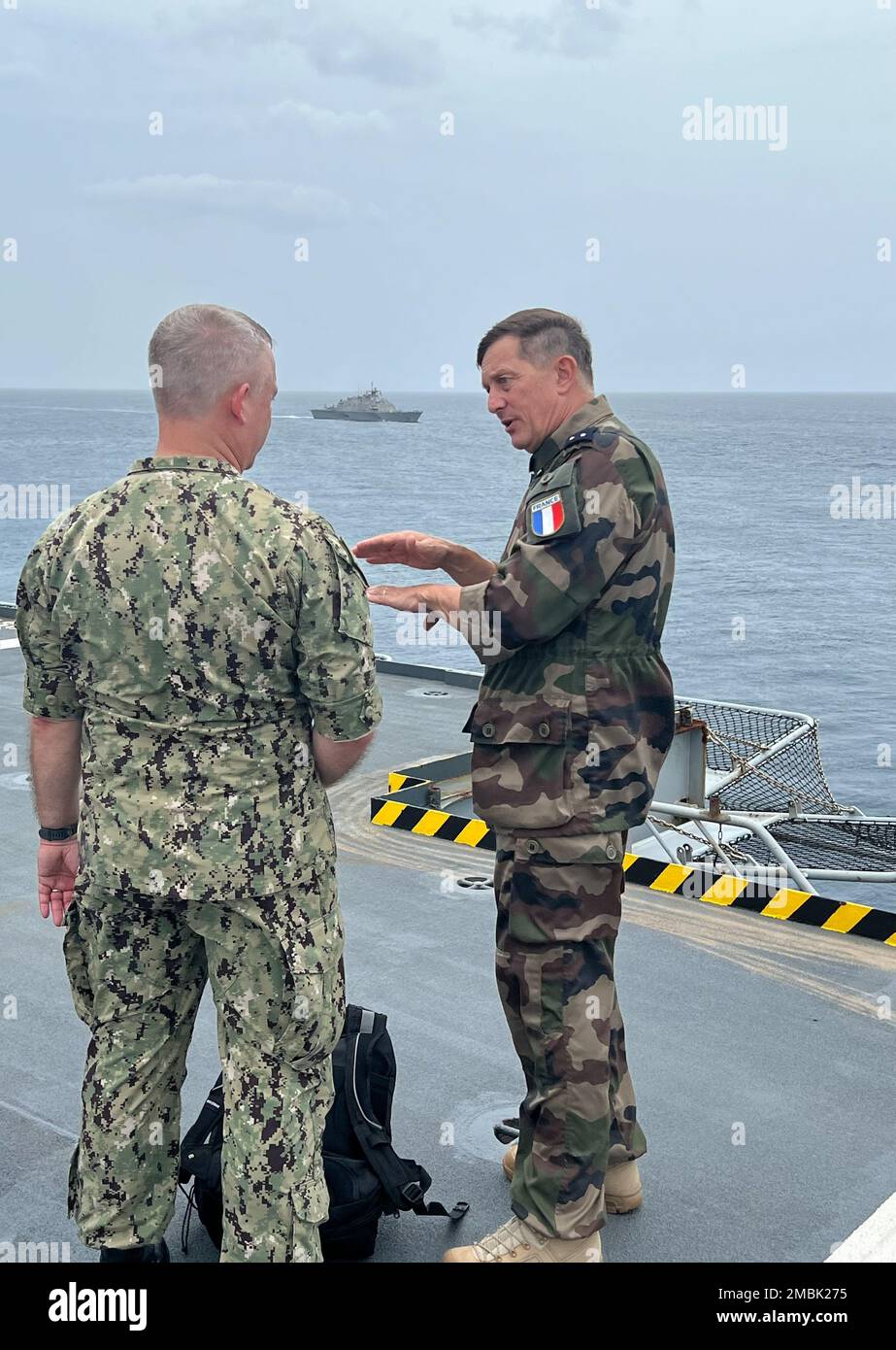 220616-N-TW039-0103  GUADELOUPE, France - (June 16, 2022) – U.S. Navy Rear Adm. Doug Sasse, Reserve Vice Commander of U.S. Naval Forces Southern Command/U.S. 4th Fleet and French navy Rear Adm. Eric Aymard, Commander-in-Chief of French forces in the Caribbean, observe operations on the French amphibious assault ship Mistral (L9013) as part of a distinguished visitor’s (DV) day demonstration during exercise Caraibes 2022, June 16, 2022. Caraibes 2022 is a French led, combined and joint training exercise in the Caribbean involving naval, air and land assets. This multi-national exercise aims to Stock Photo